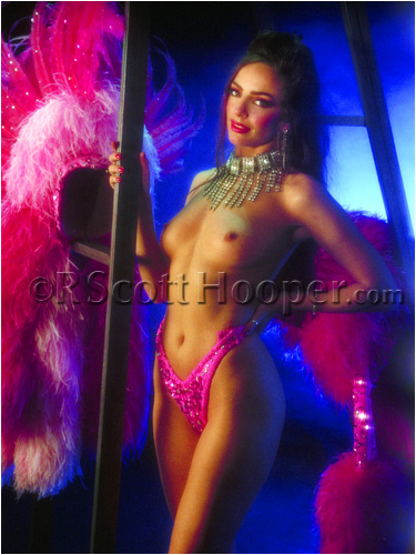 Photo of topless showgirl in pink feathers