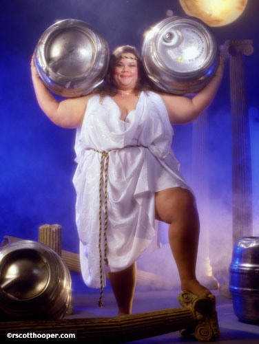 Photo of large woman holding two kegs of beer