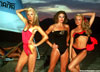 Photo of 3 girls in swimwear at dusk on the desert