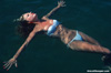 Photo of girl in the lake water in white bikini