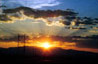 Photo of sunset with electrical towers